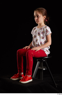 Lilly  1 dressed red leggings red shoes sitting t…